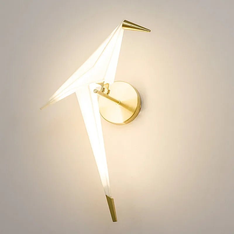Wall lamp featuring warm LED lighting and a stylish matte gold finish, designed with a unique tap and paper motif, perfect for enhancing modern interiors. 1