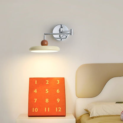 Modern minimalist wall light with adjustable arm, featuring a sleek metal and acrylic finish, perfect for contemporary home decor. 3