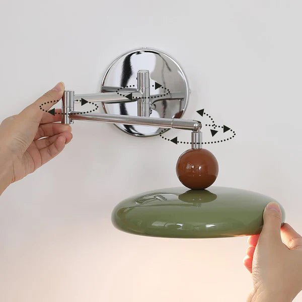 Modern minimalist wall light with adjustable arm, featuring a sleek metal and acrylic finish, perfect for contemporary home decor. 2
