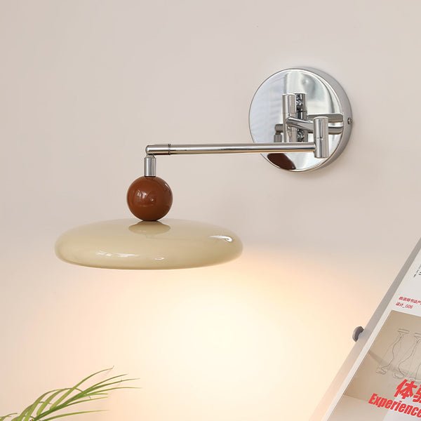 Modern minimalist wall light with adjustable arm, featuring a sleek metal and acrylic finish, perfect for contemporary home decor. 1