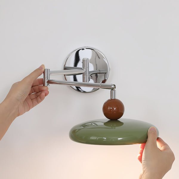 Modern minimalist wall light with adjustable arm, featuring a sleek metal and acrylic finish, perfect for contemporary home decor. 8