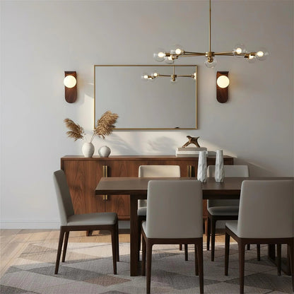 Wall light featuring a frosted globe and a wood look base, designed for compact spaces and damp-rated for both indoor and outdoor use. 6