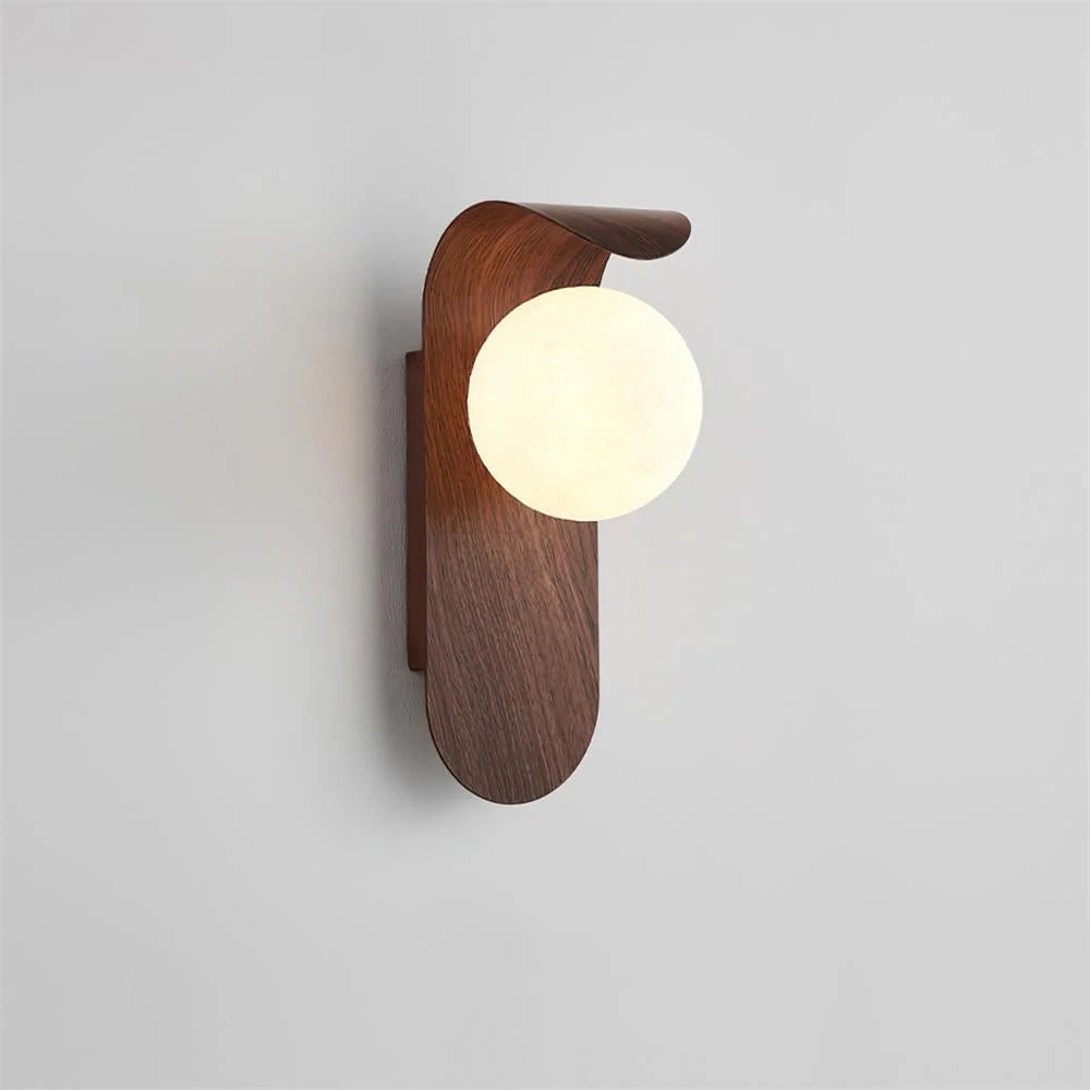 Wall light featuring a frosted globe and a wood look base, designed for compact spaces and damp-rated for both indoor and outdoor use. 0