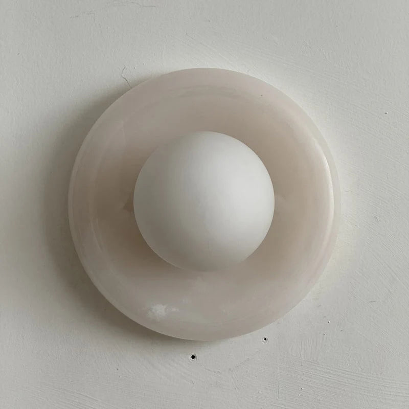 Wall light featuring a natural onyx backplate and a stylish glass globe, designed for hardwired indoor installation, perfect for enhancing home decor. 17