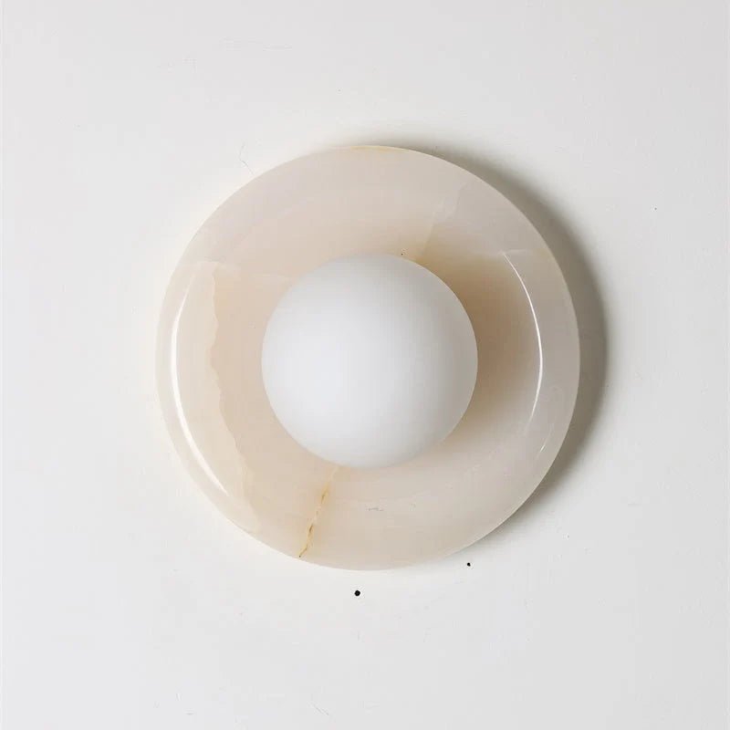 Wall light featuring a natural onyx backplate and a stylish glass globe, designed for hardwired indoor installation, perfect for enhancing home decor. 30