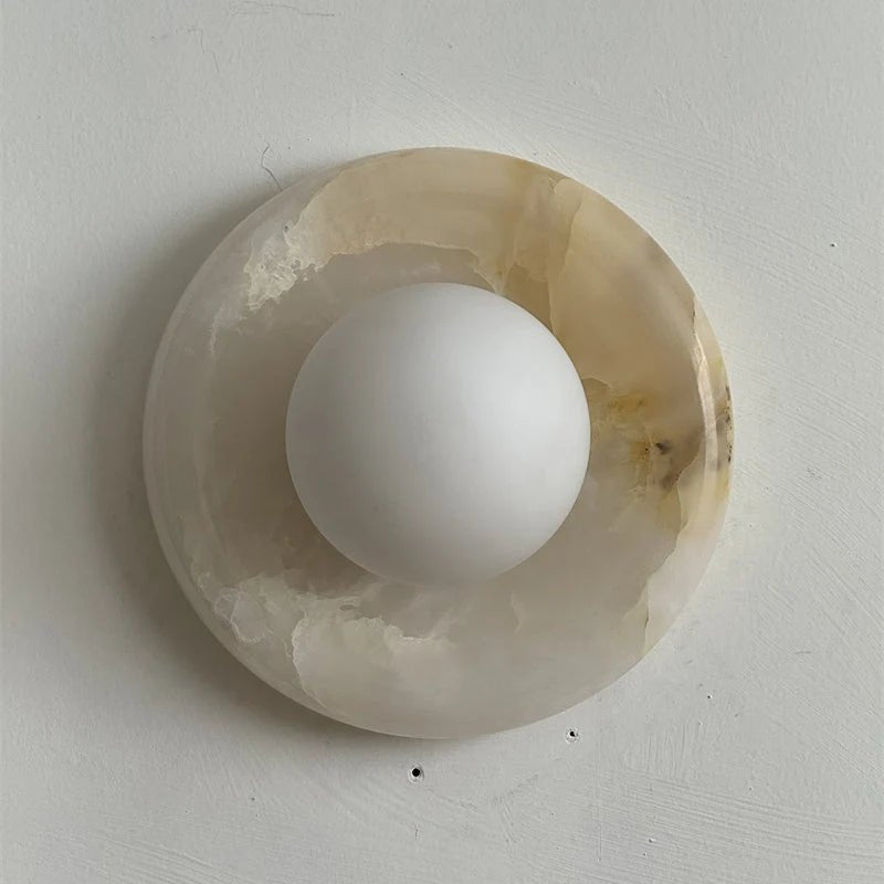 Wall light featuring a natural onyx backplate and a stylish glass globe, designed for hardwired indoor installation, perfect for enhancing home decor. 29