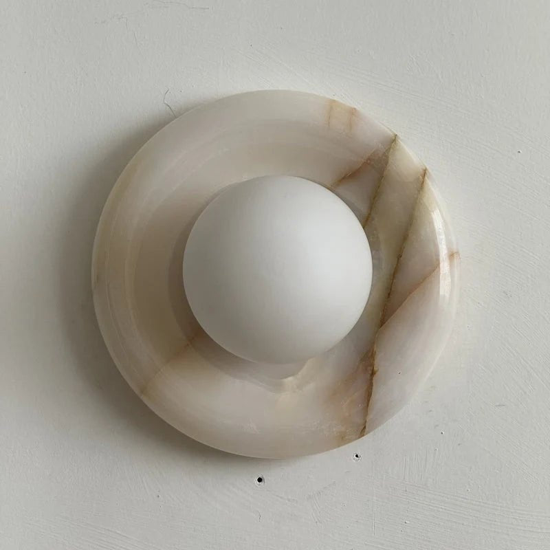 Wall light featuring a natural onyx backplate and a stylish glass globe, designed for hardwired indoor installation, perfect for enhancing home decor. 34