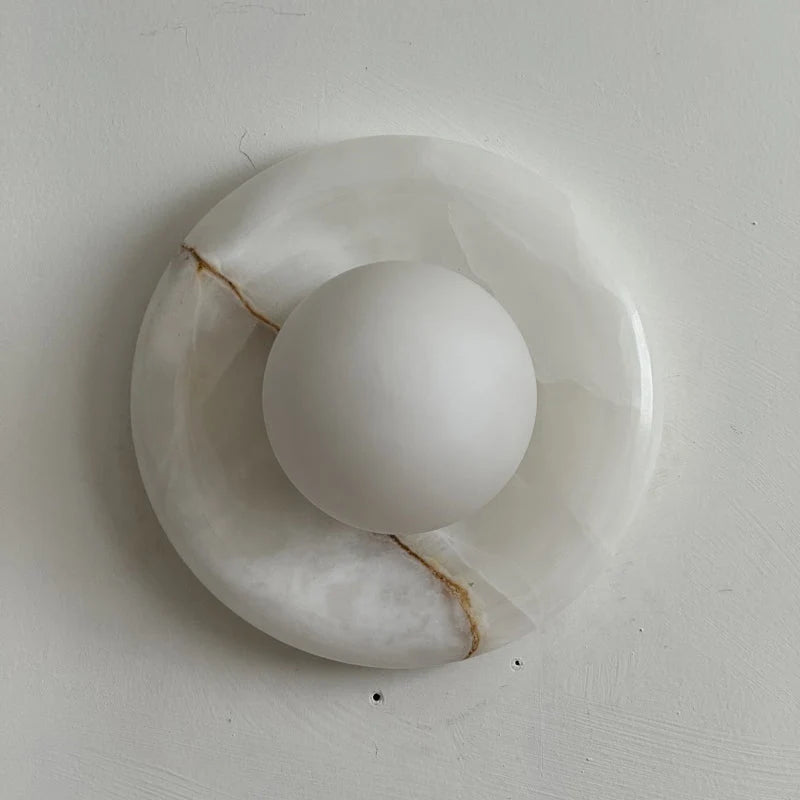 Wall light featuring a natural onyx backplate and a stylish glass globe, designed for hardwired indoor installation, perfect for enhancing home decor. 37