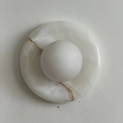 Wall light featuring a natural onyx backplate and a stylish glass globe, designed for hardwired indoor installation, perfect for enhancing home decor. 37