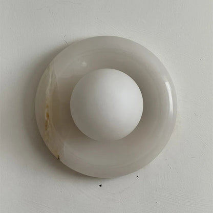 Wall light featuring a natural onyx backplate and a stylish glass globe, designed for hardwired indoor installation, perfect for enhancing home decor. 31