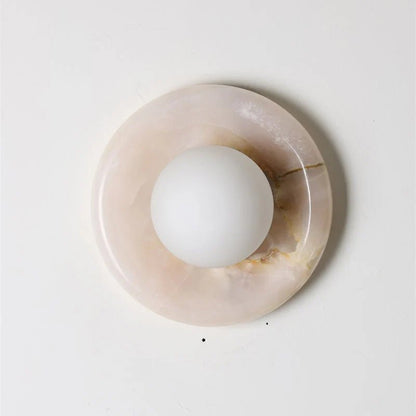 Wall light featuring a natural onyx backplate and a stylish glass globe, designed for hardwired indoor installation, perfect for enhancing home decor. 41