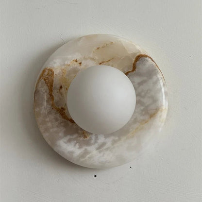 Wall light featuring a natural onyx backplate and a stylish glass globe, designed for hardwired indoor installation, perfect for enhancing home decor. 26