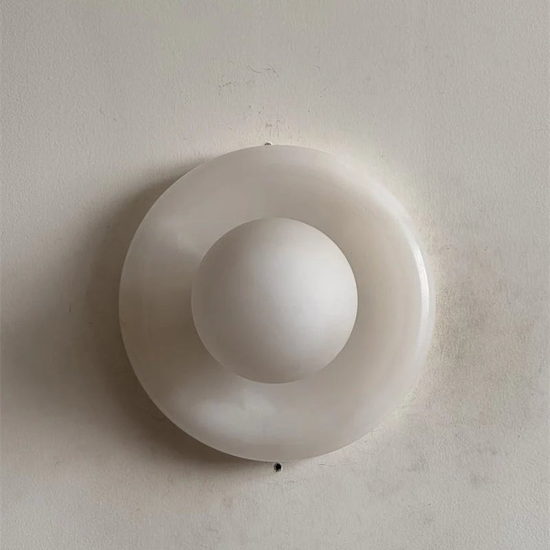 Wall light featuring a natural onyx backplate and a stylish glass globe, designed for hardwired indoor installation, perfect for enhancing home decor. 20