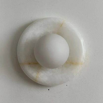 Wall light featuring a natural onyx backplate and a stylish glass globe, designed for hardwired indoor installation, perfect for enhancing home decor. 24