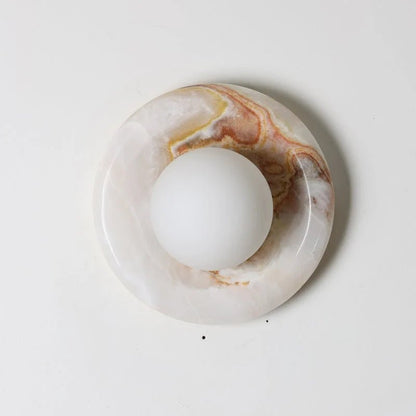 Wall light featuring a natural onyx backplate and a stylish glass globe, designed for hardwired indoor installation, perfect for enhancing home decor. 12