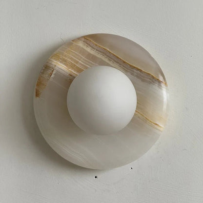 Wall light featuring a natural onyx backplate and a stylish glass globe, designed for hardwired indoor installation, perfect for enhancing home decor. 36