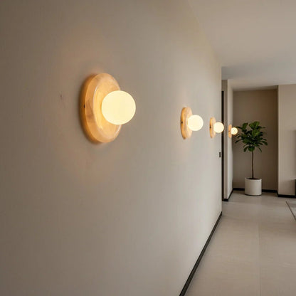Wall light featuring a natural onyx backplate and a stylish glass globe, designed for hardwired indoor installation, perfect for enhancing home decor. 6