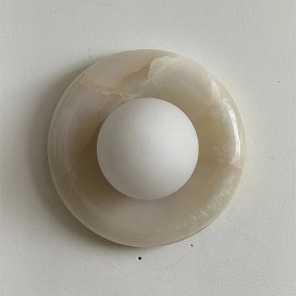 Wall light featuring a natural onyx backplate and a stylish glass globe, designed for hardwired indoor installation, perfect for enhancing home decor. 49