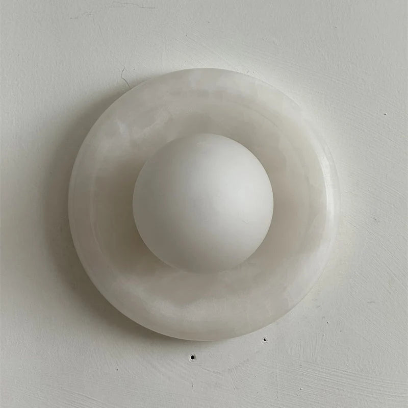 Wall light featuring a natural onyx backplate and a stylish glass globe, designed for hardwired indoor installation, perfect for enhancing home decor. 23