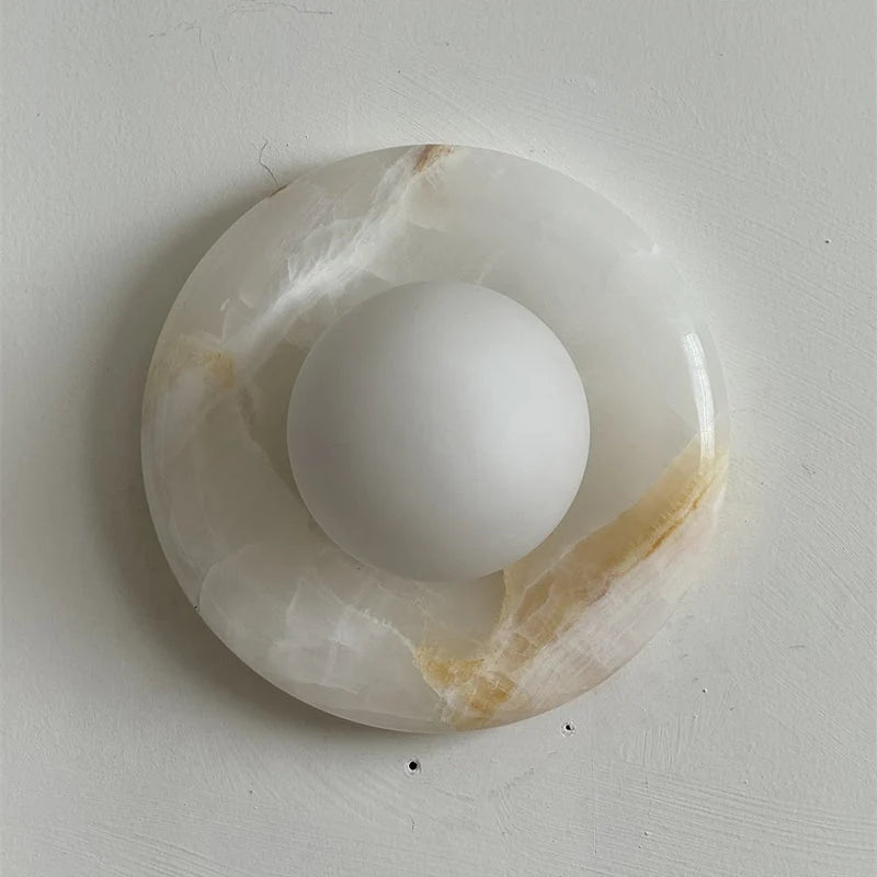 Wall light featuring a natural onyx backplate and a stylish glass globe, designed for hardwired indoor installation, perfect for enhancing home decor. 10