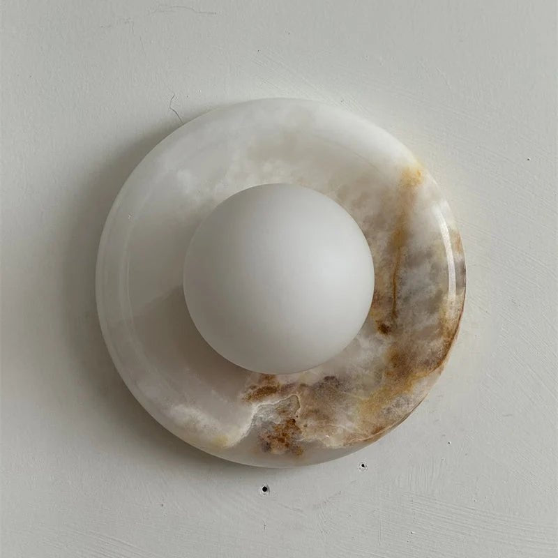 Wall light featuring a natural onyx backplate and a stylish glass globe, designed for hardwired indoor installation, perfect for enhancing home decor. 42