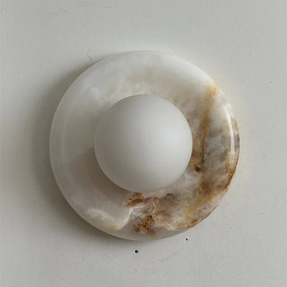 Wall light featuring a natural onyx backplate and a stylish glass globe, designed for hardwired indoor installation, perfect for enhancing home decor. 42