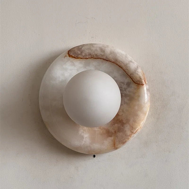 Wall light featuring a natural onyx backplate and a stylish glass globe, designed for hardwired indoor installation, perfect for enhancing home decor. 16