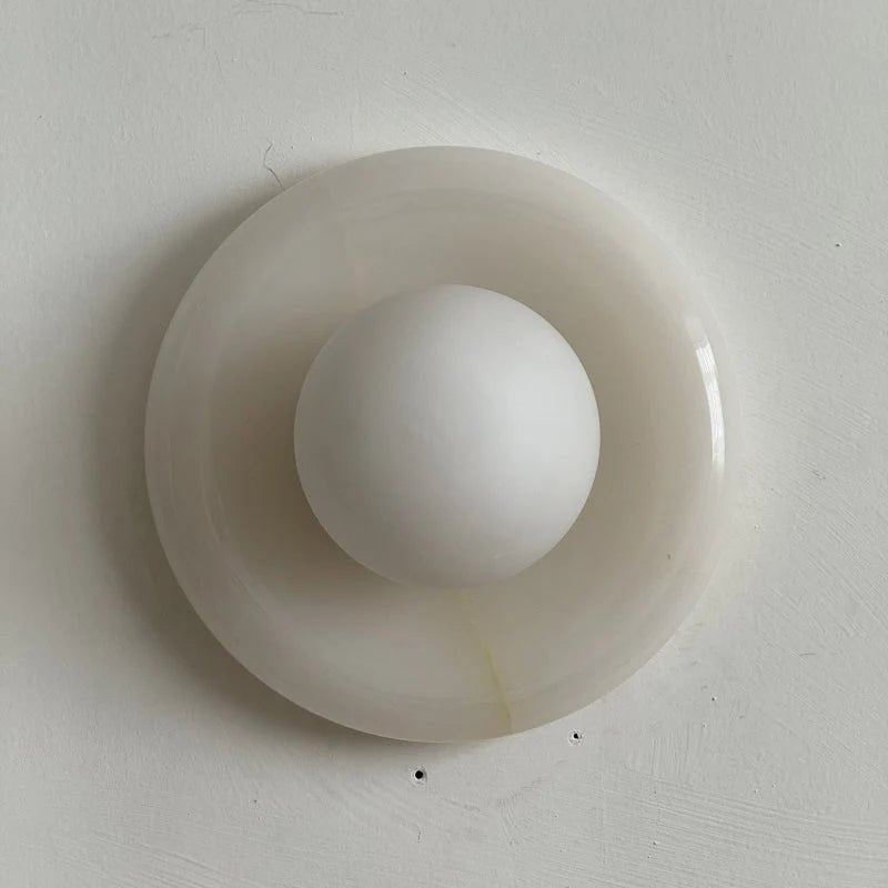 Wall light featuring a natural onyx backplate and a stylish glass globe, designed for hardwired indoor installation, perfect for enhancing home decor. 18