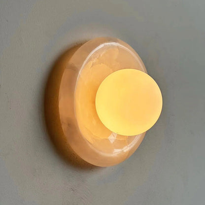 Wall light featuring a natural onyx backplate and a stylish glass globe, designed for hardwired indoor installation, perfect for enhancing home decor. 3