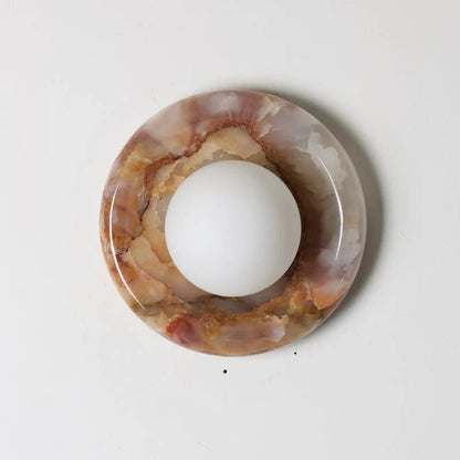 Wall light featuring a natural onyx backplate and a stylish glass globe, designed for hardwired indoor installation, perfect for enhancing home decor. 50