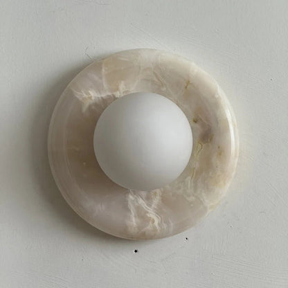 Wall light featuring a natural onyx backplate and a stylish glass globe, designed for hardwired indoor installation, perfect for enhancing home decor. 44