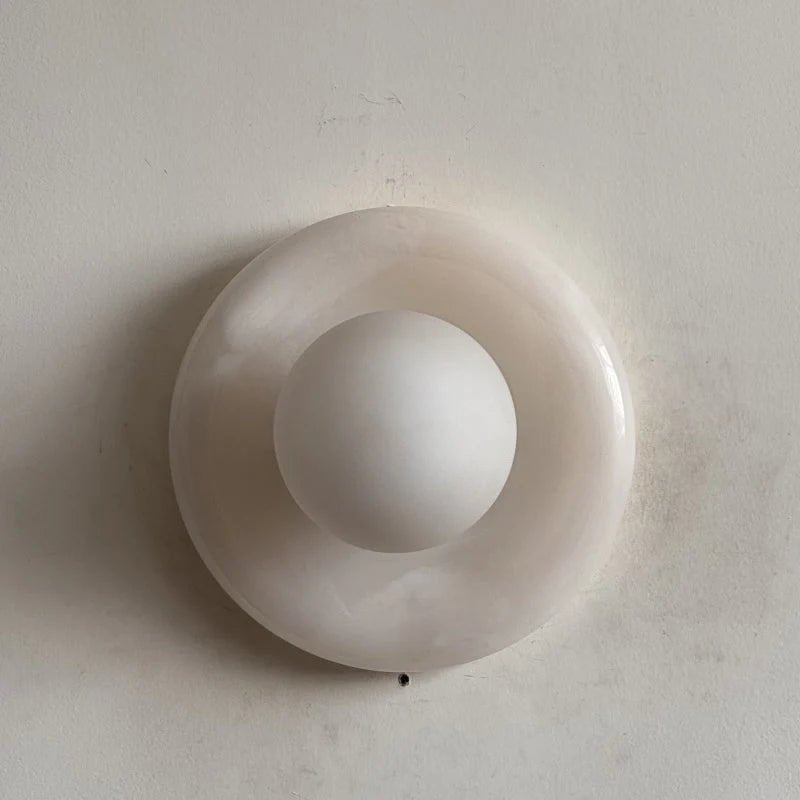Wall light featuring a natural onyx backplate and a stylish glass globe, designed for hardwired indoor installation, perfect for enhancing home decor. 25