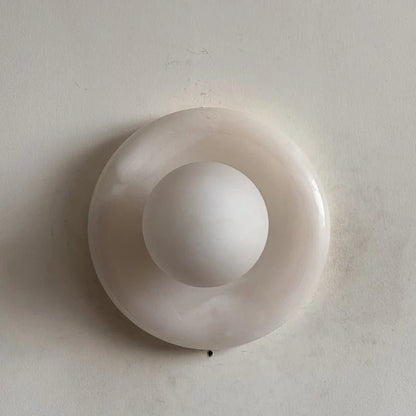 Wall light featuring a natural onyx backplate and a stylish glass globe, designed for hardwired indoor installation, perfect for enhancing home decor. 25