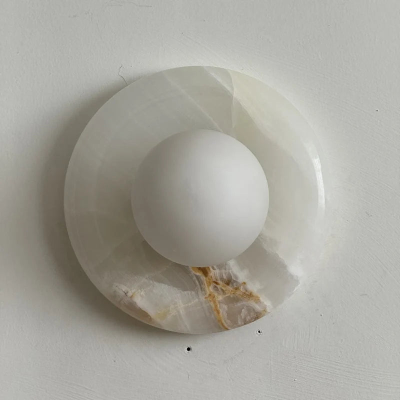 Wall light featuring a natural onyx backplate and a stylish glass globe, designed for hardwired indoor installation, perfect for enhancing home decor. 14