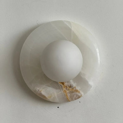 Wall light featuring a natural onyx backplate and a stylish glass globe, designed for hardwired indoor installation, perfect for enhancing home decor. 14