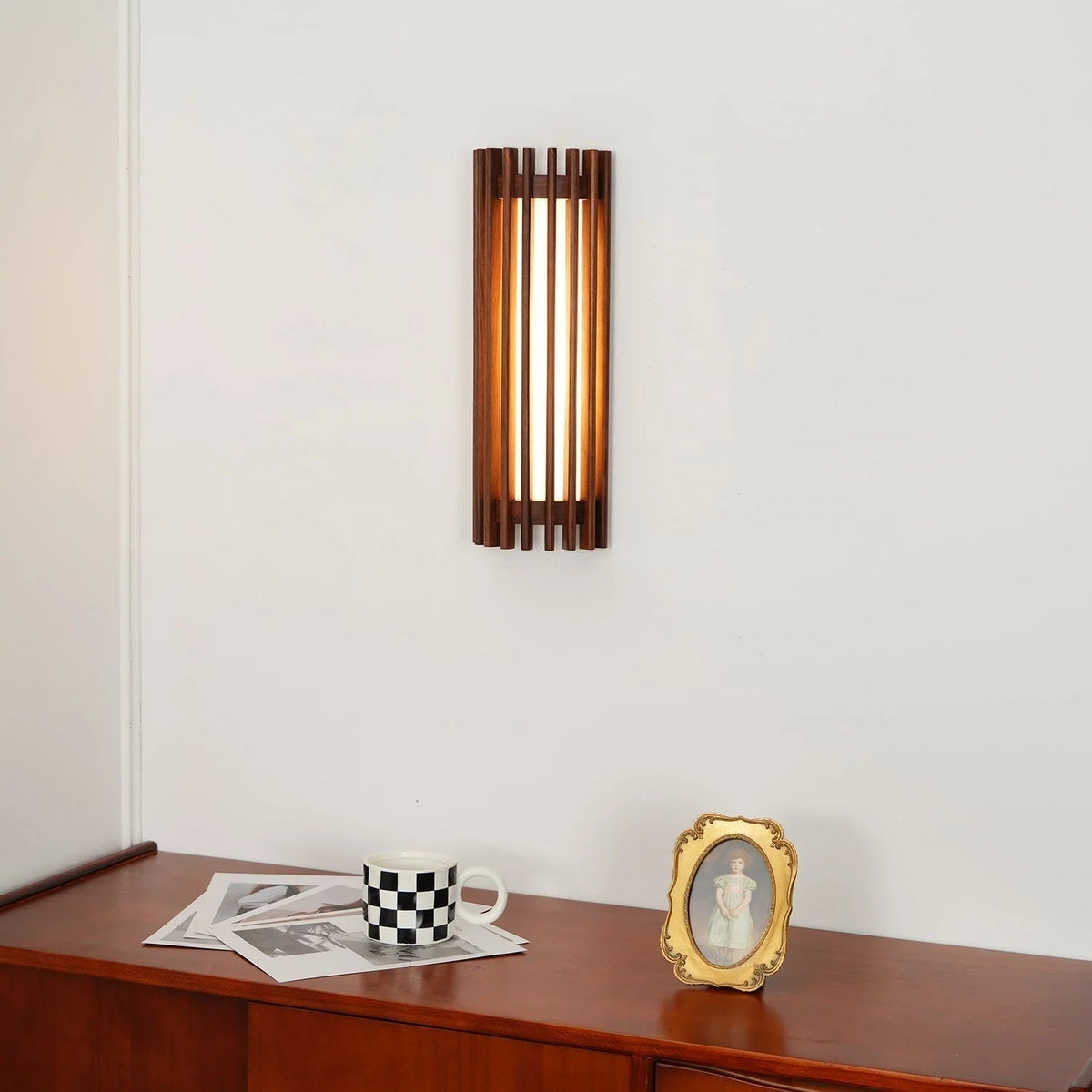 Modern wall light featuring a stylish wood and acrylic design, equipped with dimmable LED technology, available in warm or cool lighting options. 5