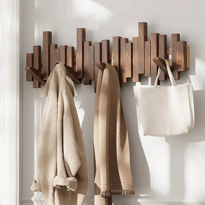 Wall mounted coat rack featuring a minimalist design in walnut or beech wood, ideal for stylish entryway organization with multiple hooks for coats and accessories. 2