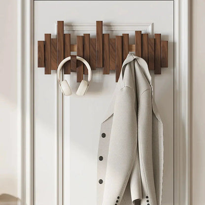 Wall mounted coat rack featuring a minimalist design in walnut or beech wood, ideal for stylish entryway organization with multiple hooks for coats and accessories. 4