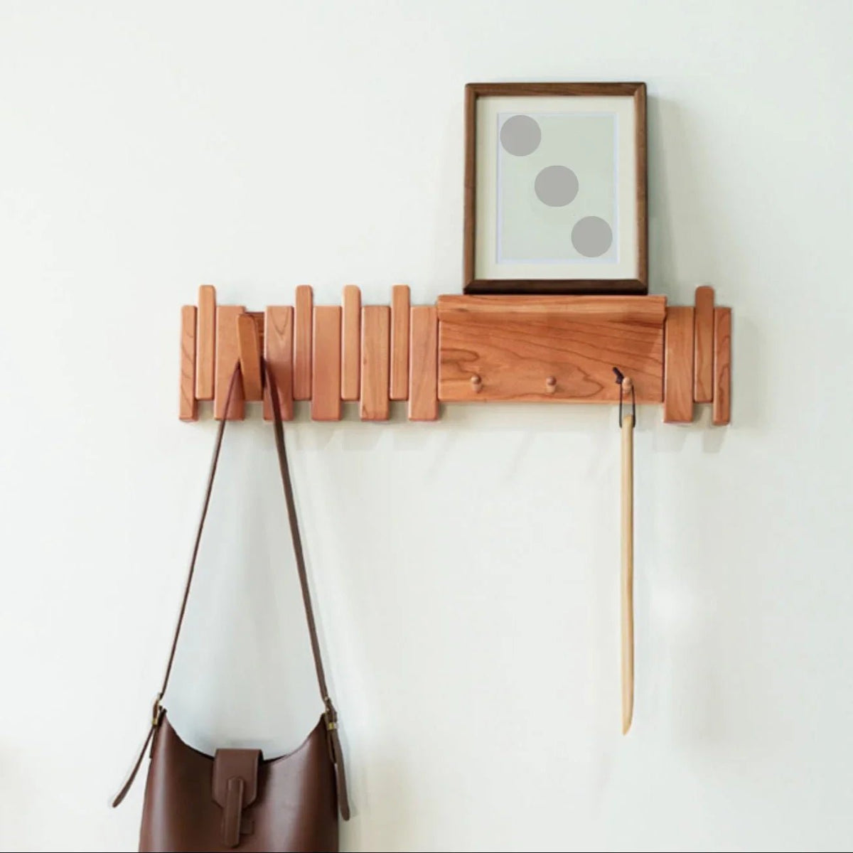 Wall-mounted coat rack featuring a unique piano key design, crafted from solid wood for durability and style, perfect for space-saving organization in entryways or hall 2