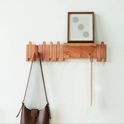 Wall-mounted coat rack featuring a unique piano key design, crafted from solid wood for durability and style, perfect for space-saving organization in entryways or hall 2