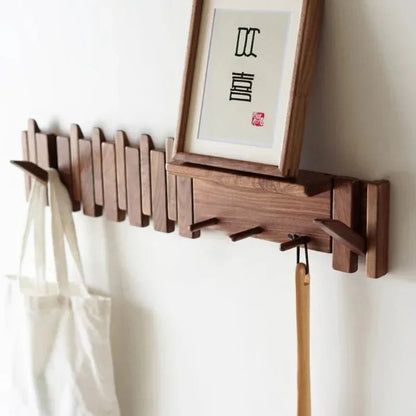 Wall-mounted coat rack featuring a unique piano key design, crafted from solid wood for durability and style, perfect for space-saving organization in entryways or hall 0