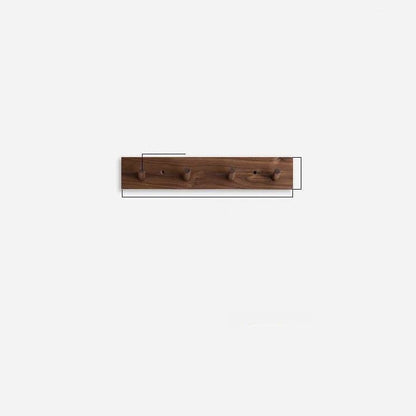 Wall mounted coat rack featuring round pegs, crafted from minimalist solid wood in walnut or beech, perfect for modern entryway decor. 3