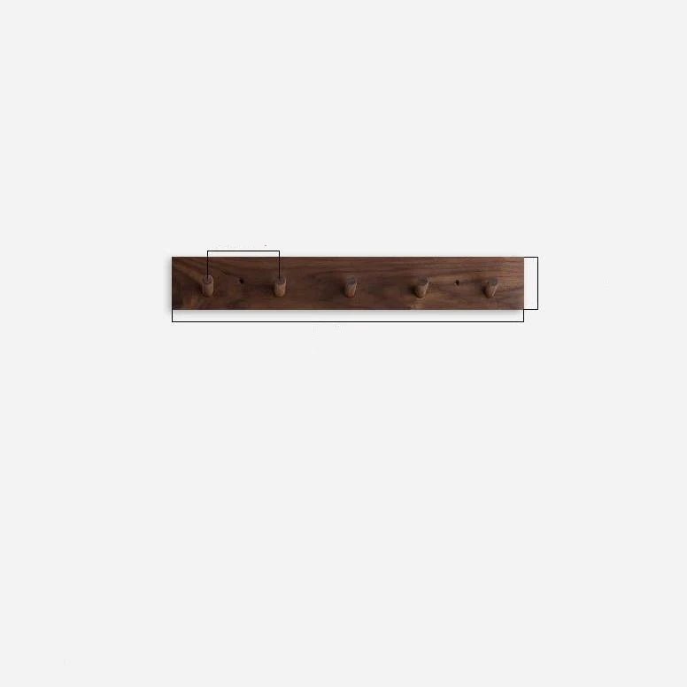 Wall mounted coat rack featuring round pegs, crafted from minimalist solid wood in walnut or beech, perfect for modern entryway decor. 4