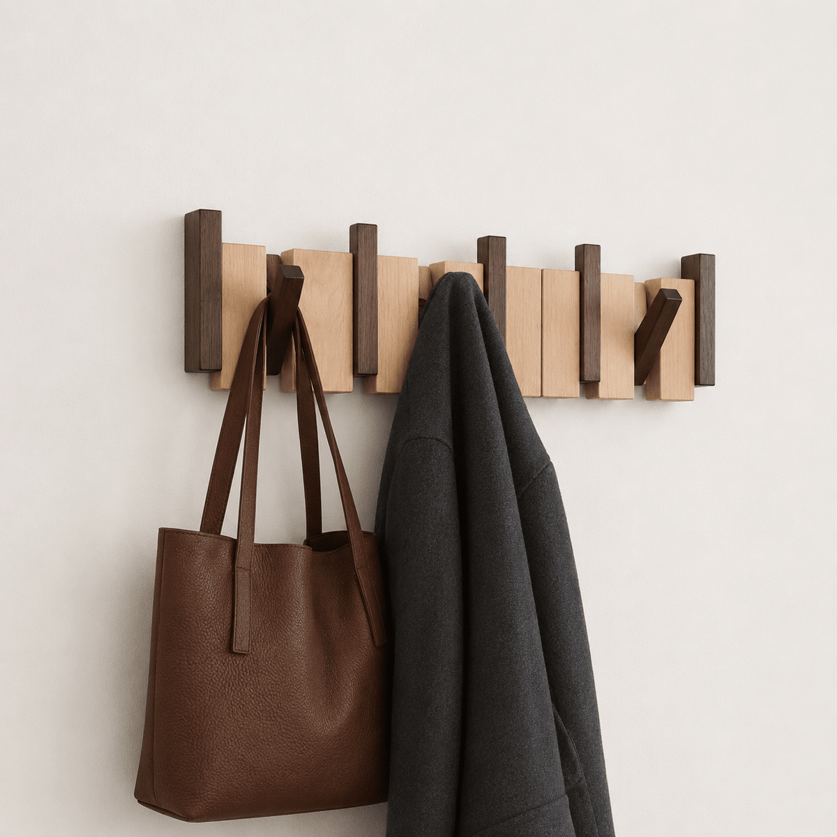 Wall-mounted wooden coat rack featuring foldable hooks in a stylish piano key design, crafted from solid timber for durability and elegance. 2