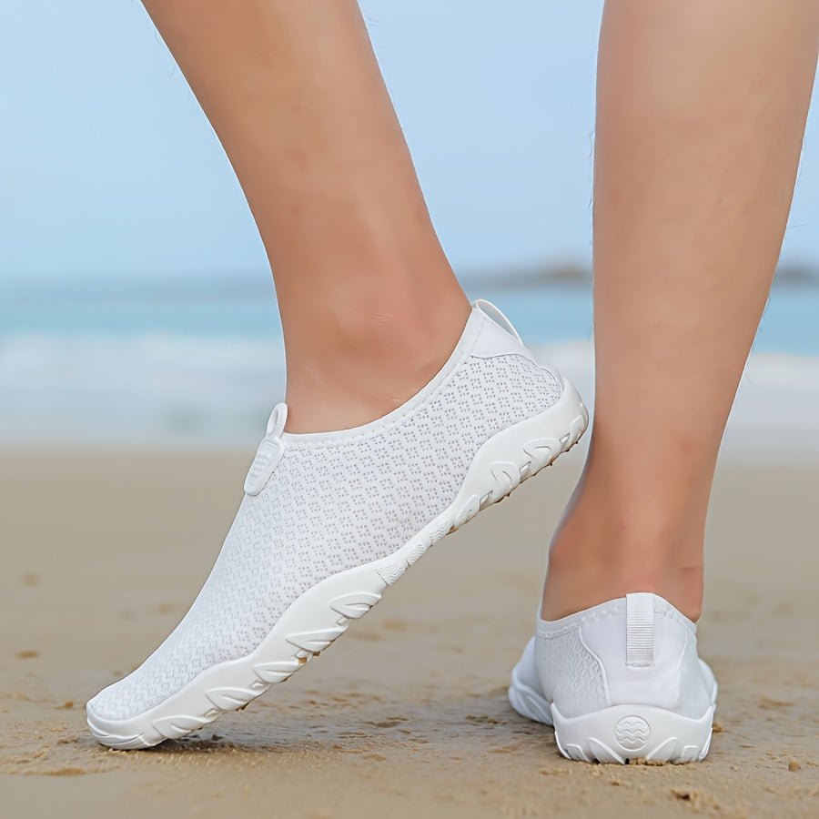 Water shoes for women featuring a quick-dry breathable mesh upper and a non-slip rubber sole, perfect for beach and swimming activities. 0