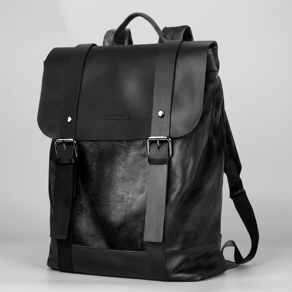 Waterproof leather laptop backpack featuring padded straps and multiple pockets, designed for style and durability, perfect for everyday use. 4