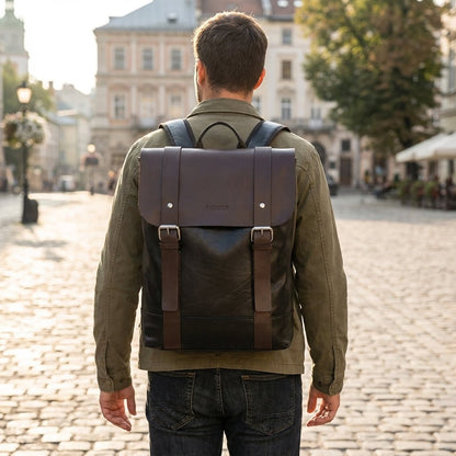 Waterproof leather laptop backpack featuring padded straps and multiple pockets, designed for style and durability, perfect for everyday use. 1