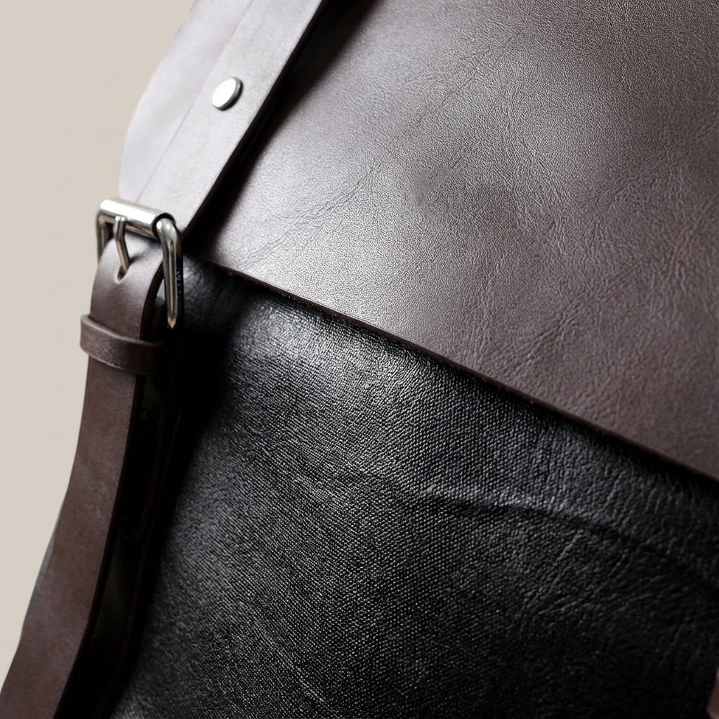 Waterproof leather laptop backpack featuring padded straps and multiple pockets, designed for style and durability, perfect for everyday use. 3