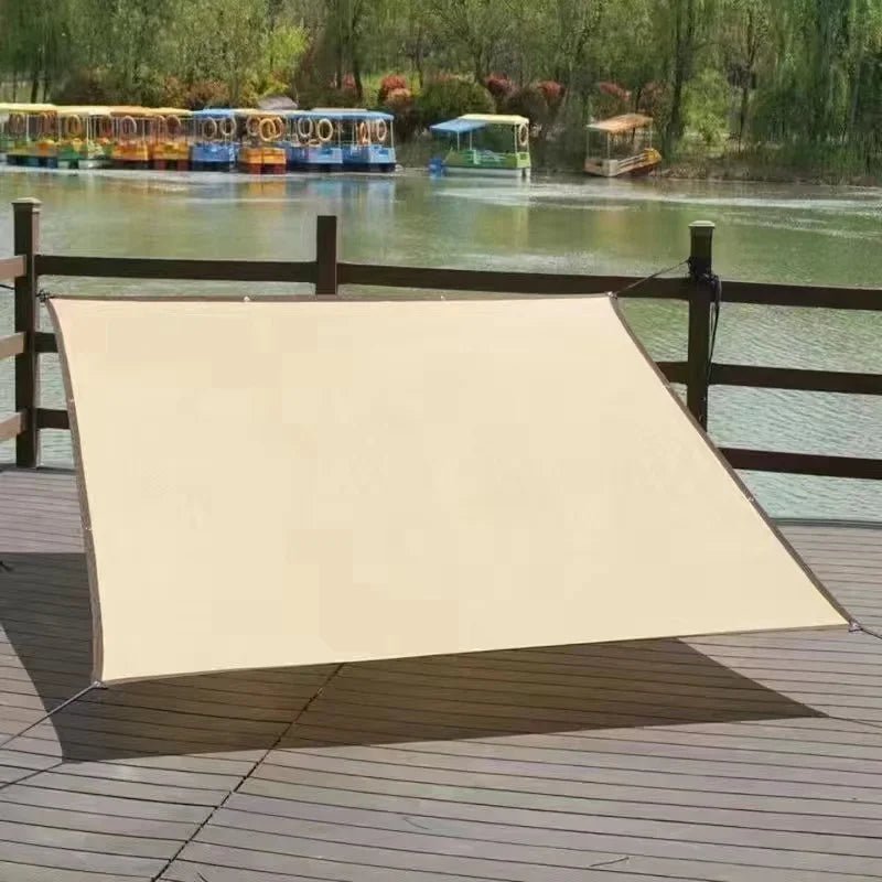 Waterproof rectangular shade sail made of high-density polyethylene, featuring reinforced corners, designed for outdoor shading with 90% UV protection. 6