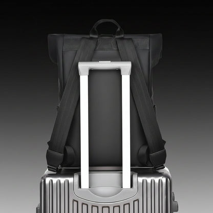 Waterproof travel backpack in minimalist black design featuring a USB charging port and roll-top closure, ideal for carrying laptops and daily essentials. 3